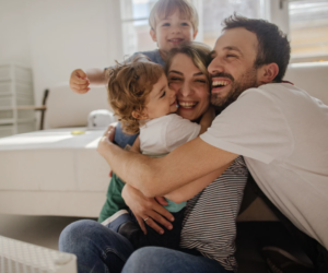 Happy family of mom, dad and 2 kids